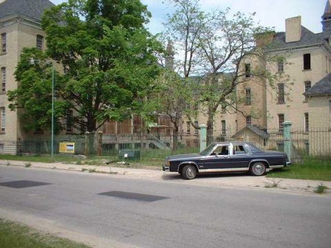 1984 Ford Crown Victoria LTD - Behind Building 50, the main building of the Traverse City State Hospital, which is being converted into an apartment community.
