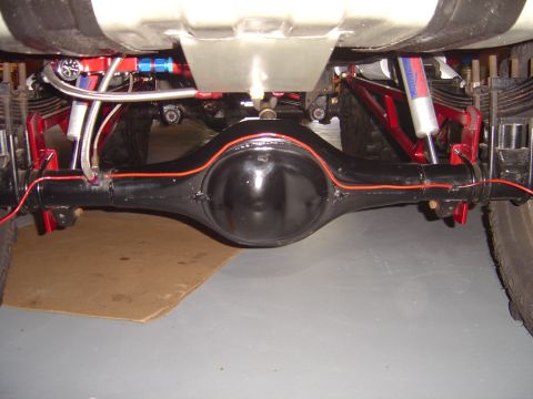 1978 Ford Bronco - Underside view of a vehicle's rear axle and suspension system, showing custom modifications.
