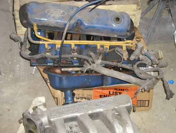Ford engine parts on a box