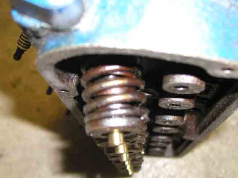 1988 Ford Bronco - Close-up view of an engine's valve spring assembly, showing mechanical components.