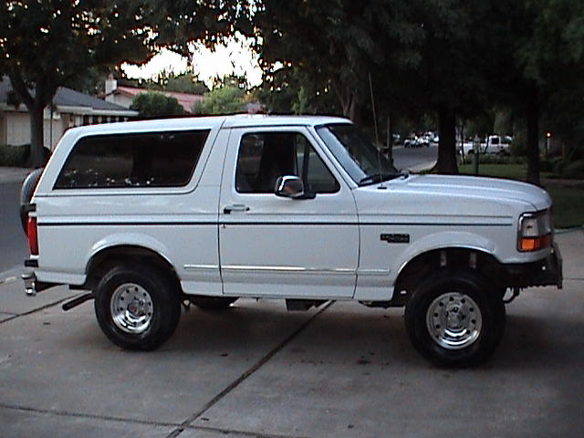 White 1994 Ford Bronco side view