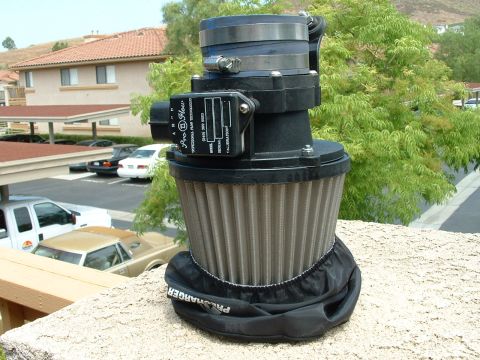 1992 Ford Crown Victoria - Close-up of an aftermarket air intake system part, possibly for an engine upgrade.
