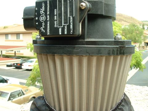 1992 Ford Crown Victoria - A Pro-Flow air filter is shown with legible text and markings, with vehicles visible in the background.