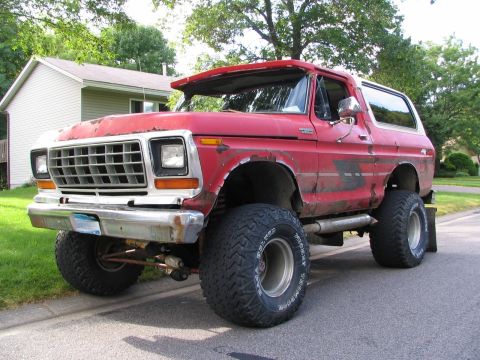 1978 Ford Bronco - This red 1978 Ford Bronco is modified with a lifted suspension and oversized tires.