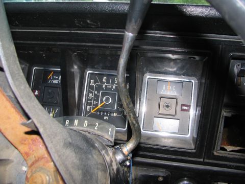 1978 Ford Bronco - Interior view of a 1978 Ford Bronco dashboard, showing gauges and the gear selector.