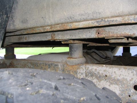 1978 Ford Bronco - Undercarriage view shows significant rust on the frame and suspension components.