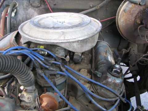 1978 Ford Bronco - Close-up view of an engine bay, focusing on the air cleaner and ignition system components.