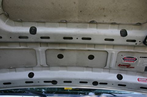 1994 Ford Bronco - I had to drill 1 3/8" holes in the frame using a hole saw to be able to put the nuts and washers on the studs.