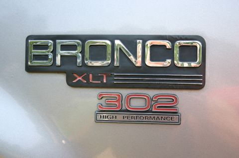1994 Ford Bronco - Close-up of Ford Bronco XLT and 302 High Performance badges.