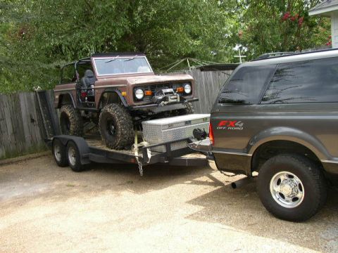 1995 Ford Bronco - A modified 1978 Ford Bronco is loaded onto a trailer behind a Ford Super Duty truck.