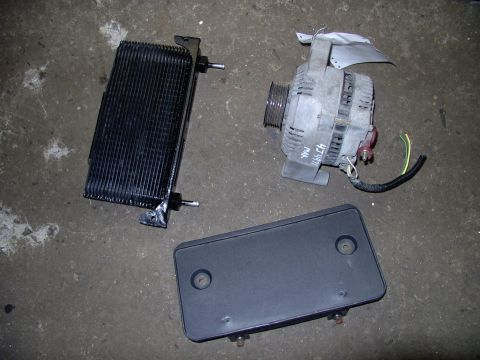 1986 Ford Bronco - Happy, happy, Joy, Joy ! Got the 3G 130 amp alternator for $60 CDN. The stacked plate trans cooler (which is exactly like my B&M Supercoole…