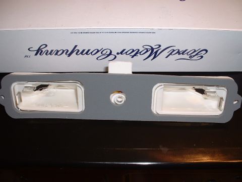 1978 Ford Mustang II - A Ford Motor Company branded box contains a license plate light assembly with two clear lenses.