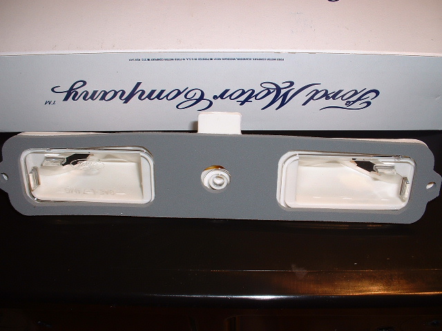 Ford license plate light assembly with "Ford Motor Company" text on box