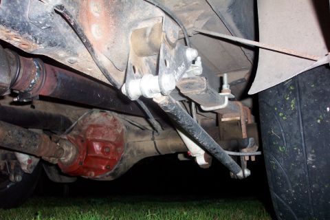 1994 Ford F-150 - Close-up view of the rear suspension and drivetrain components of a vehicle.