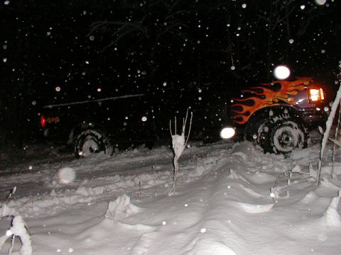 1991 Ford F-150 - Truck with flame decals is stuck in the snow during a winter night.