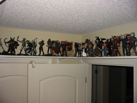 1991 Ford Bronco - Various action figures and statues displayed on a shelf.