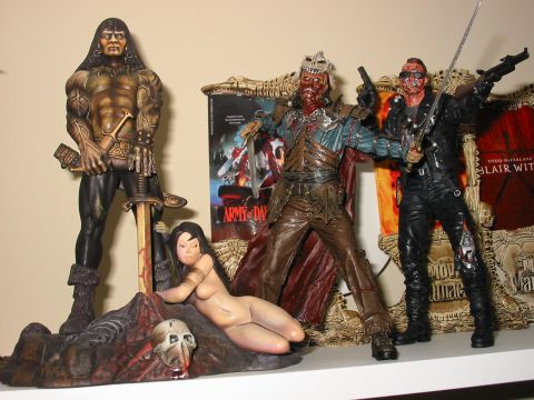 1991 Ford Bronco - A collection of horror and fantasy action figures and movie posters are displayed together.