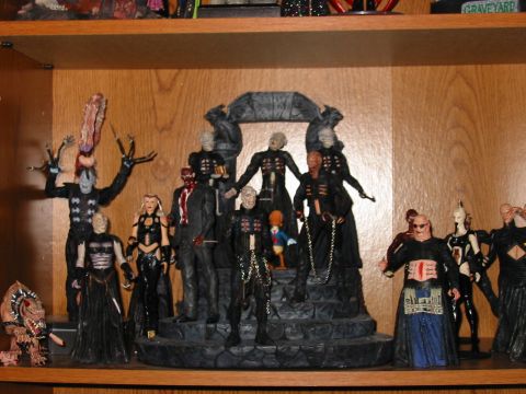 1991 Ford Bronco - A shelf displays a collection of horror movie action figures, primarily from the Hellraiser franchise.