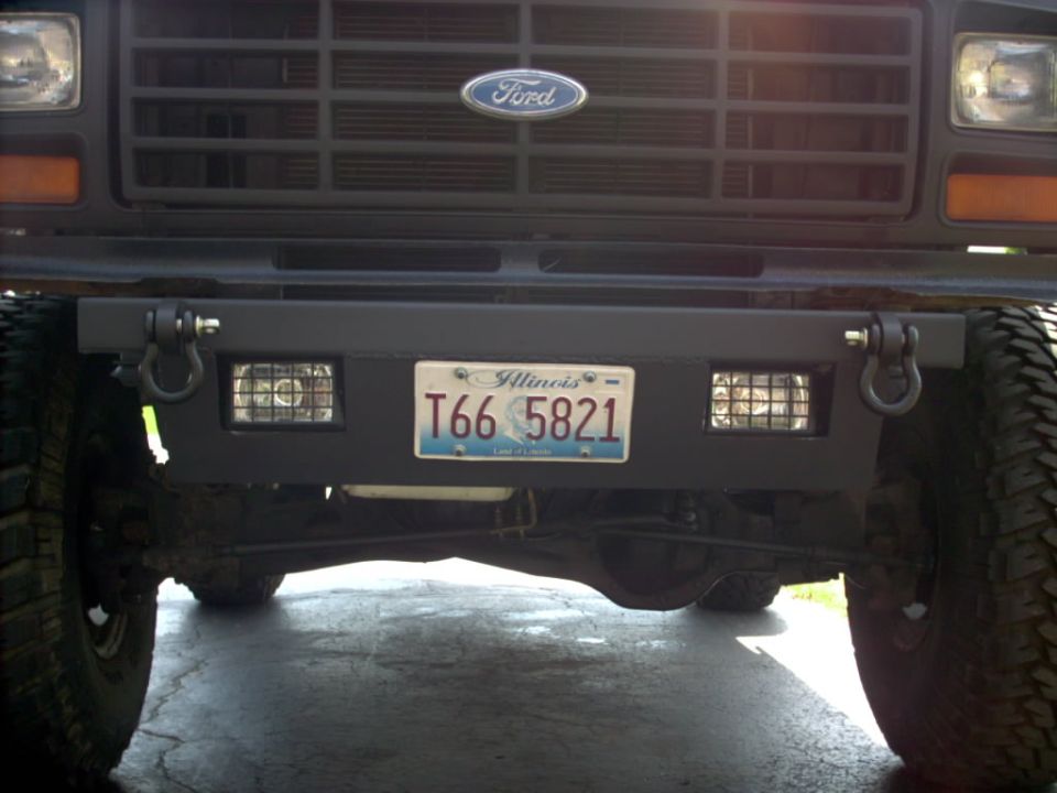 Ford front bumper with D-rings, Illinois plate T66 5821, and Ford grille above