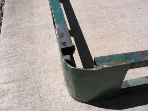 1991 Ford Explorer - A close-up view of a green metal roof rack section, showing its construction and condition.