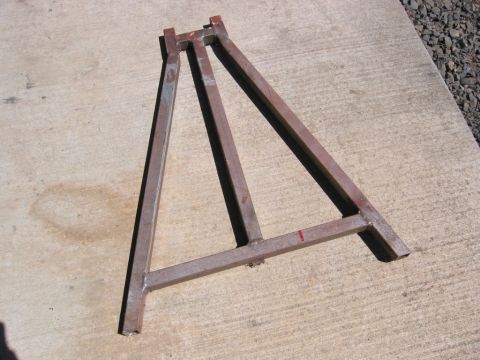1991 Ford Explorer - A homemade metal A-frame stand rests on a concrete surface.