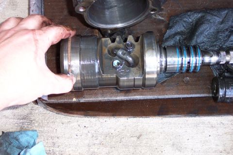 1992 Ford Bronco - Here is the piston with worm gear installed. Remove the two bolts, and then the two half-moon ball bearing guides. Rotate the worm gear to…
