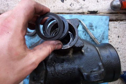 1992 Ford Bronco - Install the new sector shaft seals. This is the correct orientation. That lip is what makes the old snap ring difficult to remove. Again, j…