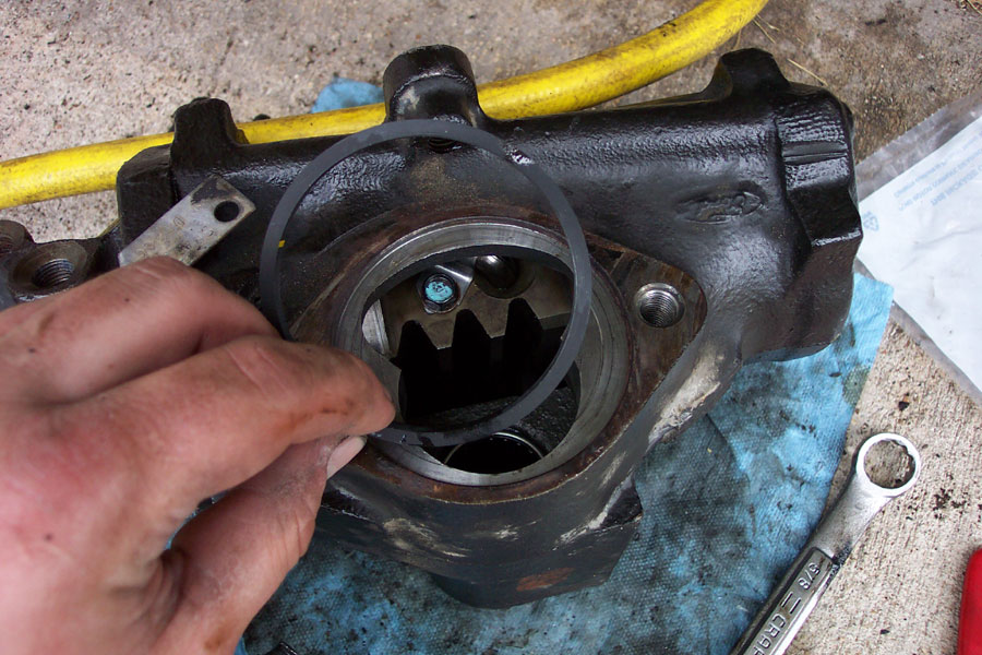 Reinstall the piston and position it like this.  I found it helpful to coat the teflon ring in fresh power steering fluid before installing.  This is where you will use the final seal from the sector shaft kit.