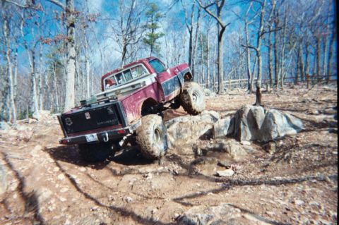 1985 Ford Bronco - This pickup truck is off-roading on a rocky trail.