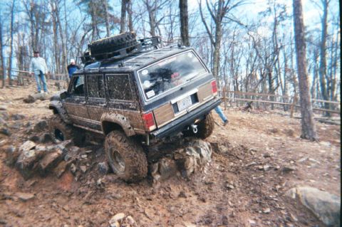 1985 Ford Bronco - This vehicle is equipped for extreme off-road conditions, with large tires and a lifted suspension.
