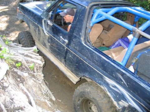 1989 Dodge Power Ram - This modified truck navigates a challenging off-road course, its capabilities.