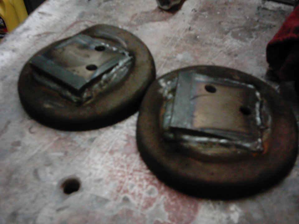 Two welded metal parts with bolt holes