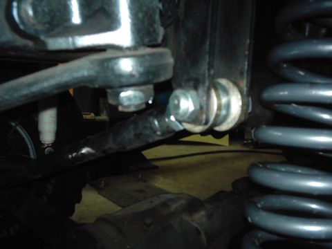 1978 Ford Bronco - Undercarriage view of suspension parts, including a linkage and coil spring, with Supermotors.net logo visible.