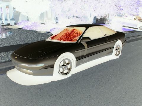 1993 Ford Probe - A black 1993 Ford Probe GT is parked on the street, with a red object visible through the windshield.