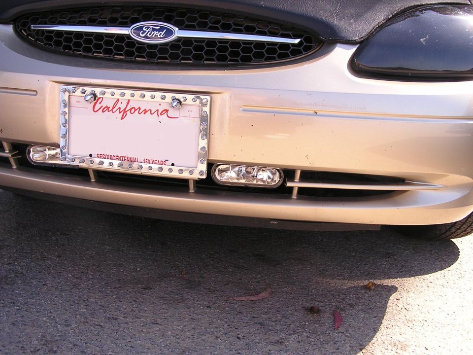 Gold 1993 Ford Taurus front grille and California license plate