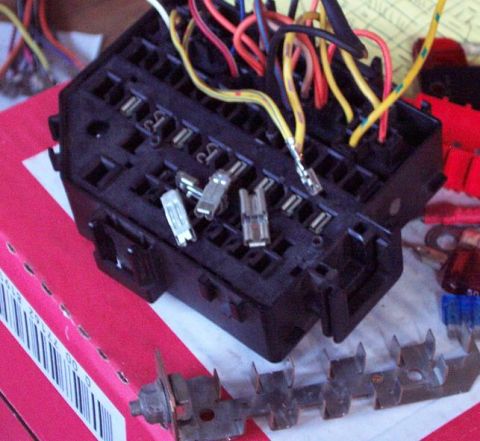 1985 Ford Crown Victoria LTD - Automotive fuse box with wiring and assorted fuses, likely for electrical system repair or modification.