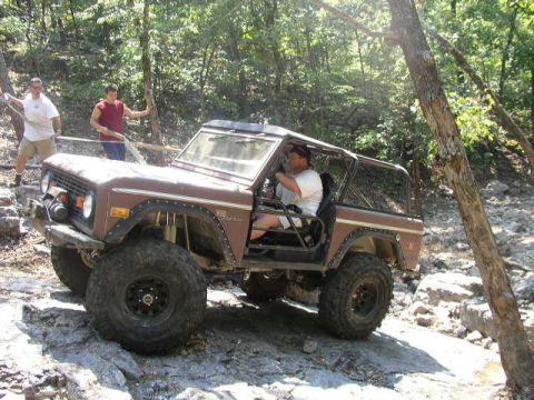 1995 Ford Bronco - A driver navigates a off-road course in a classic Ford Bronco.