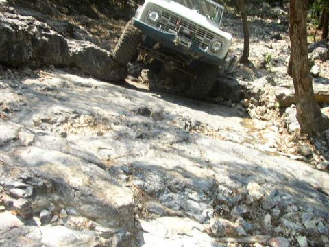 1995 Ford Bronco - This 1978 Ford Bronco tackles a challenging rocky trail, its off-road capabilities.