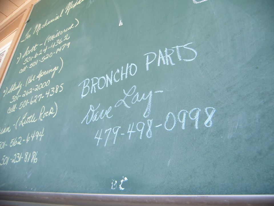Chalkboard listing 'Broncho Parts' and contact info for Dave Lay