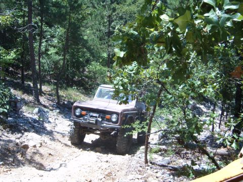 1988 Ford Bronco - This 1978 Ford Bronco navigates a rocky, wooded trail.
