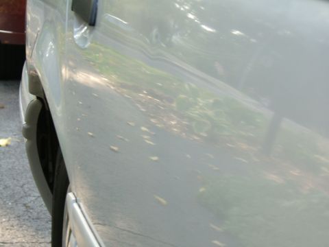 1998 Ford Taurus - Side view of a car's door and wheel well, with a SUPERMOTORS watermark visible.