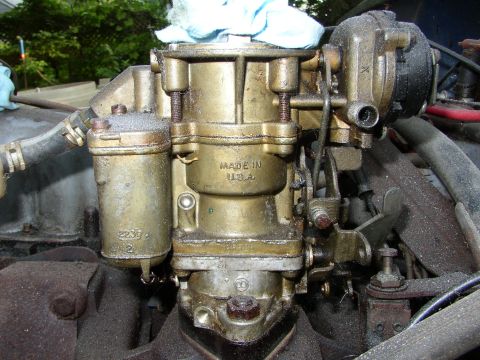 1973 Jeep CJ5 - A close-up view of a carburetor, showing "MADE IN U.S.A." stamped on its casing.