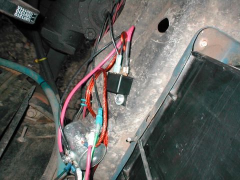 1979 Ford Bronco - Detail of a vehicle's electrical system showing wiring and a relay.