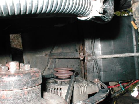 1979 Ford Bronco - The image shows the alternator and belt-driven pulleys within the engine bay.