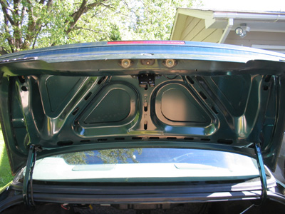1995 Ford Taurus - The interior of a car's trunk is visible, with a SuperMotors.net logo in the lower right corner.