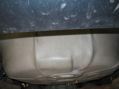 1995 Ford Taurus - Underside view of a vehicle's fuel tank. The SuperMotors.net logo is present in the corner.