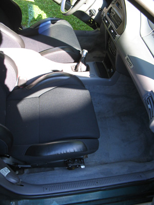 1995 Ford Taurus - The interior of a 1995 Ford Taurus is visible, with a focus on the front seats and dashboard area.