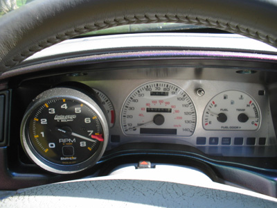 1995 Ford Taurus - Interior view of a car's dashboard, showing a tachometer and other gauges.