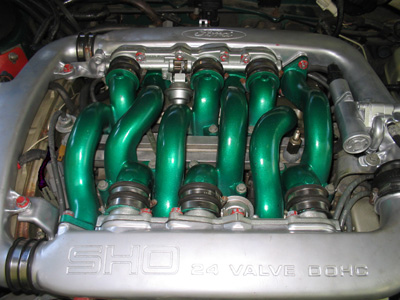 1995 Ford Taurus - Close-up of a SHO 3.0 engine custom green intake runners and silver manifold.