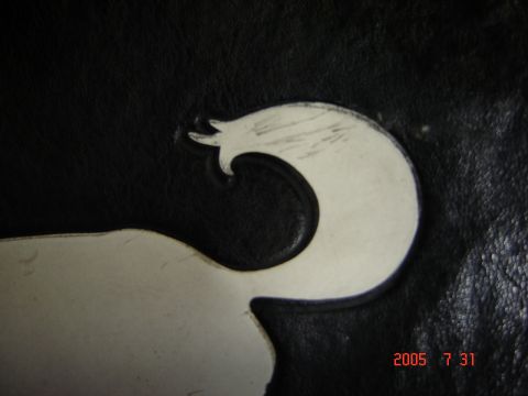 1993 Ford Bronco - Close-up of a black tire cover a white graphic, with a date stamp from 2005 visible.